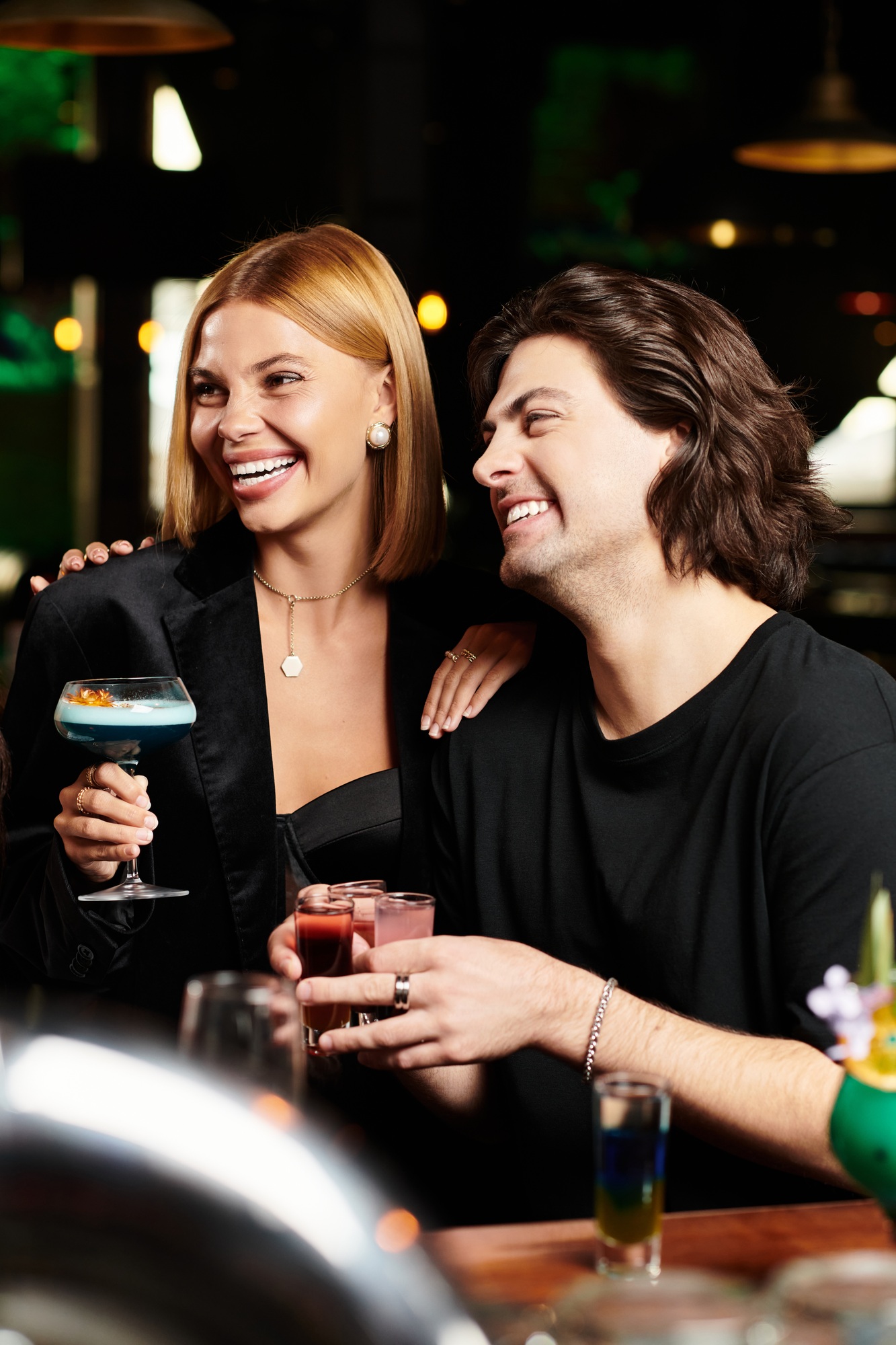 Young diverse colleagues celebrating success together at a corporate party late at night